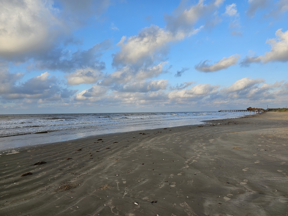 A wide stretch of empty beach